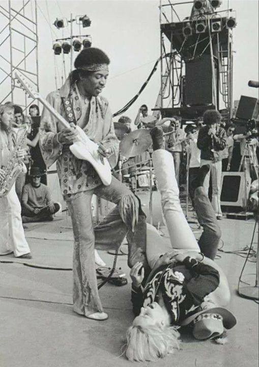 A female fan tries to get to JIMI HENDRIX onstage at the Newport ‘69 Pop Festival at Devonshire Downs in Northridge, California, June 22, 1969.